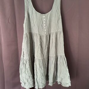 Entro Green  Sleeveless dress dress is a darker green.